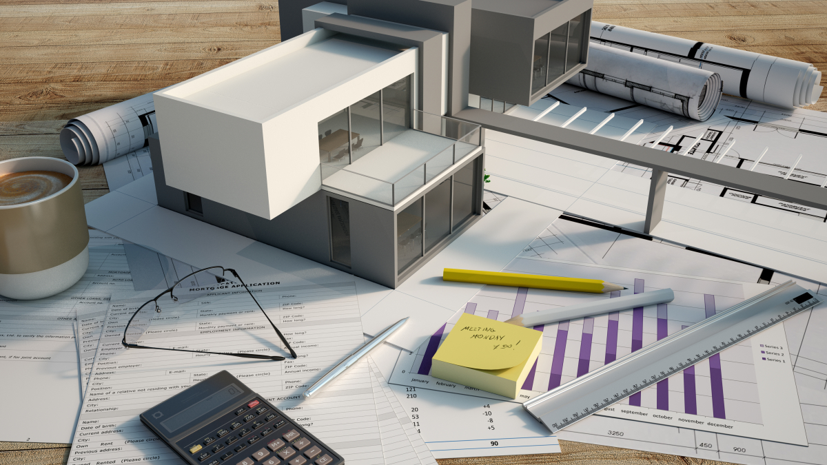 Maison modulable – Vue d’une maquette de maison neuve posée sur des plans